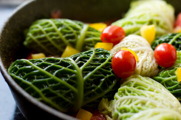 Сlose-up of stuffed Cabbage Rolls are loaded with a tender and juicy ground beef and rice filling, wrapped up in a boiled cabbage leaf, gluten-free,
 and lower-carb comfort food dish your family is su