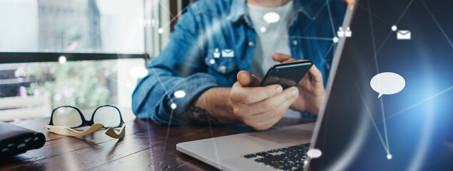 Male hands with laptop. Man working remotely at home. Concept of networking or remote work. Global business network.