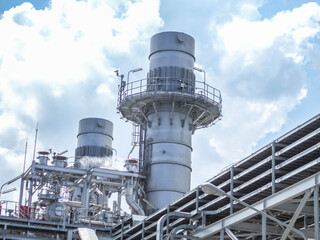 Stack and sky of Heat recovery steam generator in Combined-Cycle Co-Generation Power Plant.