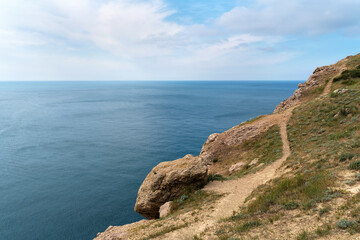 Beautiful seascape from high cliff on sunny day. Beautiful summer landscape. Natural background. Travel concept.