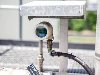 Temperature sensor for measuring instrument close up in industry zone at power plant.