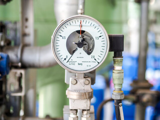 Pressure gauge of measuring instrument close up in industry zone at power plant with closed up