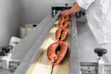 Sausages. Packing line of sausages. Industrial manufacture of sausage products. High quality photo