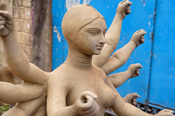 Clay idol of Goddess Devi Durga is in preparation for the upcoming Durga Puja festival at a pottery studio in Kolkata, West Bengal, India.