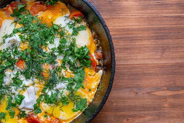 Poached eggs with tomatoes and spices