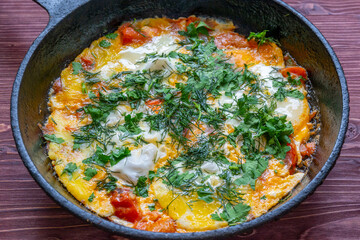 Poached eggs with tomatoes and spices