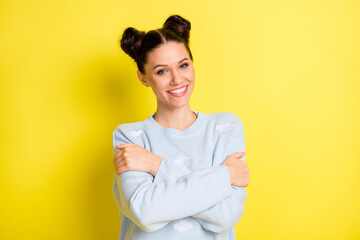 Photo of inspired tender lady embrace shoulders toothy beaming smile wear blue sweater isolated yellow background