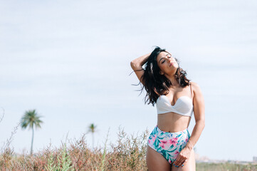 attractive young woman in bikini on the beach