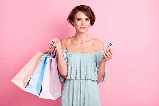 Photo of young attractive woman happy smile use smartphone shop black friday sale isolated over pastel color background