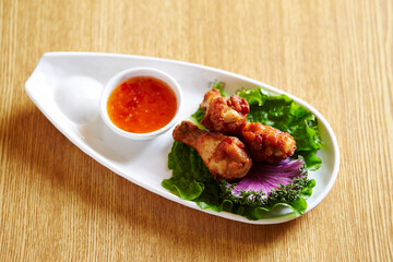 Grilled Chicken and Sauce on a Plate 