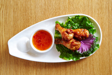 Grilled Chicken and Sauce on a Plate 