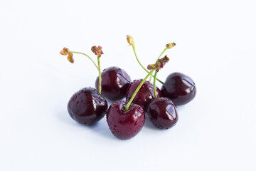 Close-up on cherry on the white background. Copy space.