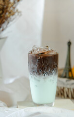 delicious iced chocolate ​mint latte on table in cafe	