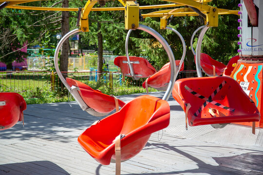 amusement park, seat with seat belts, for a passenger on a carousel