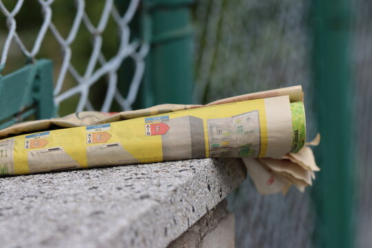 metal fence, newspaper