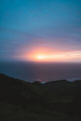Sun setting on the atlantic ocean from the top of Jaizkibel hills