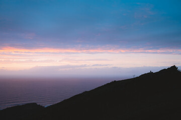 Silhouette of a tree on the hills of Jaizkibel during sunset
