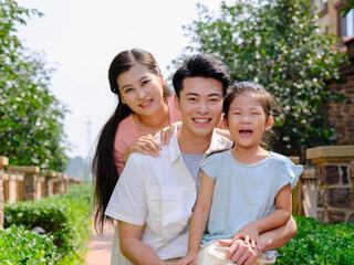 Happy family of three in the outdoor group photo