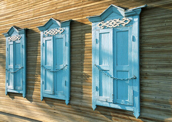 The window of an old Russian wooden house from the times of the Russian Empire.