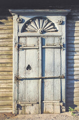 The window of an old Russian wooden house from the times of the Russian Empire.