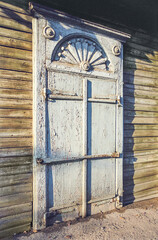 The window of an old Russian wooden house from the times of the Russian Empire.