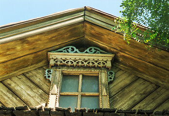 Pediment with decor. Part of an old Russian wooden house.