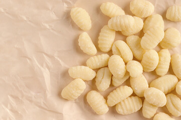 homemade gnocchi on a paper background. Copy space