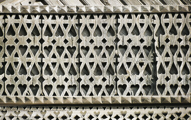 Carved details of the facade of an old Russian wooden house from the times of the Russian Empire.