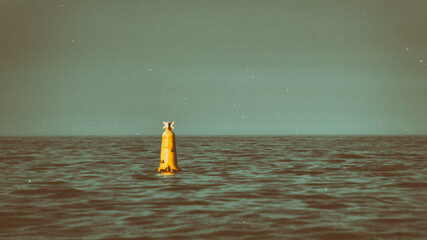 Orange and Teal Retro Look of Yellow Buoy in the Irish Sea