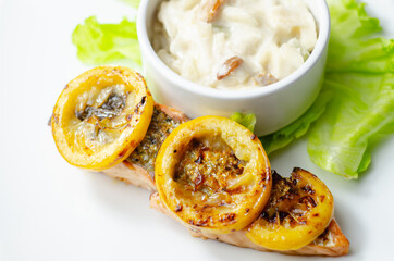 Grilled salmon fillet served with an exquisite salad consisting of cabbage, celery and apple with sultanas and roasted peanuts in mayonnaise