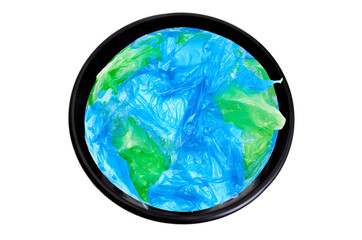 Earth globe made from plastic bags in a waste bin isolated on white