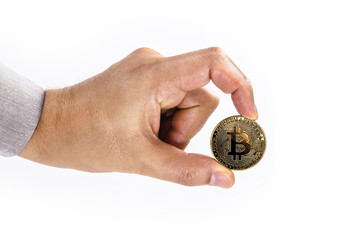 Naklejka na ściany i meble male hand holding bitcoin coin on isolated white background with space copy