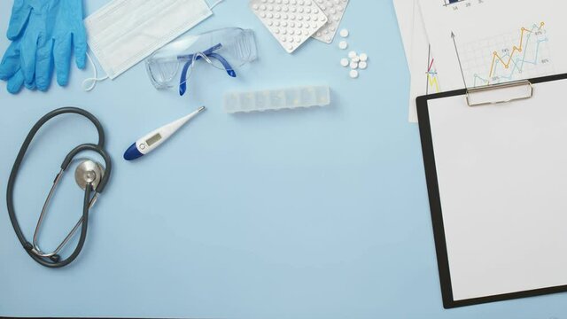 Word addiction is made up of wooden letters on the medical table, a view from above. Concept of addiction and dependence on drugs.