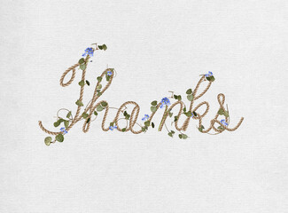 Thanks text in cursive writing with green ivy and blue flowers on white linen textured background