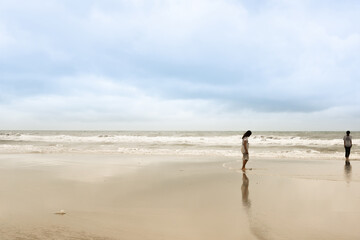 Vintage and retro toning of tropical beach with blue sky and clear sea which including of a wooden umbrella and chair in sunrise time with vintage retro tone. Vacation time as concept.