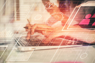 Multi exposure of woman hands working on computer and data theme hologram drawing. Tech concept.