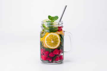 Cocktail isolated on white background. Lemon and lime, mint and raspberries cocktail.