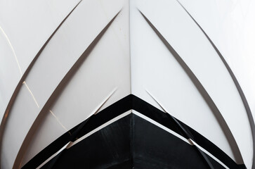 The bow of the yacht, bottom view, close-up. The waterline is clearly visible. Front of a luxury...