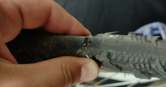 Repairer repairs a punctured bicycle tire	
