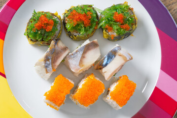 Sushi mixed set with different fish, seaweed and caviar. Restaurant home food delivery. close up