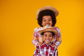 Afro brothers dressed in junina party clothes  Brazilian party called 