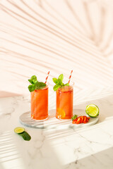 Strawberry mojito. Summer cocktails made from strawberries, lime and mint. 