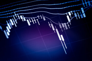 Financial data of stock market in term of a digital prices on LED display. A number of daily market price and quotation of prices chart to represent candle stick tracking in Forex trading.	