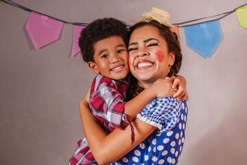 Afro mother and son dressed for June party Brazilian party called 