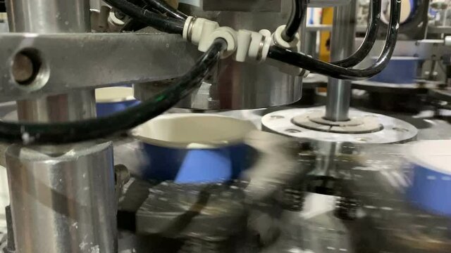 Coffee-to-go cup production on a machine.