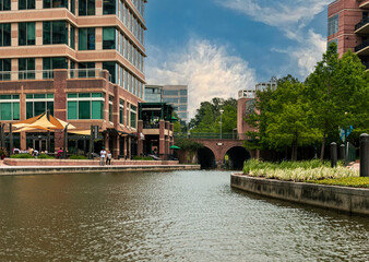 a view of office buildings from the Waterway in the Woodlands, TX