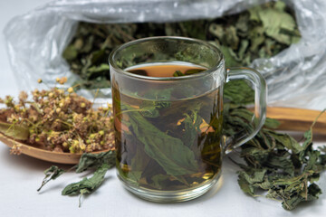 Herbal treatment. Brewed mint tea. Dried mint and linden