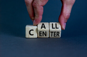 Call center symbol. Businessman turns wooden cubes with words 'Call center'. Beautiful grey background. Call center and business concept. Copy space.