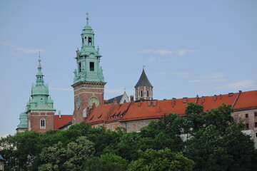 Towers on Wawel cathedral in Krakow, Poland against blue sky