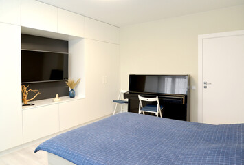 Living room interior with piano and TV. Modern minimalism
